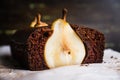 Pear chocolate cake on the rustic background