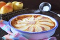 Pear clafoutis and yellow pears in wicker basket Royalty Free Stock Photo