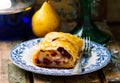 Pear and cranberry strudel .selective focus. Royalty Free Stock Photo