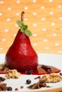 Pear flavored with red wine with Brachetto syrup and crunch nuts