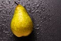 Pear fruit isolated on wet black background Royalty Free Stock Photo