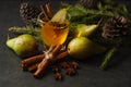 Pear Ginger punch with spices on dark stone surface Royalty Free Stock Photo