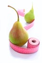 Pear hand with measuring tape healthy lifestyle organic food on a white