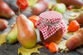 Pear jam and ripe pears on old wooden table. Autumn still life. Royalty Free Stock Photo