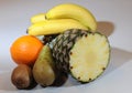 Pear, orange, kiwi, pineapple and banana compositon. Royalty Free Stock Photo