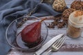 Pear with red wine served in a glass bowl in rustic presentation on a wooden table. dive view, close-up Royalty Free Stock Photo