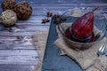 Pear with red wine served in a glass bowl on a slab in rustic presentation on a wooden table. dive view Royalty Free Stock Photo