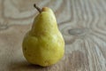 Juicy yellow Bartlett pear on rustic wooden table Royalty Free Stock Photo