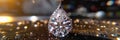 Pear-shaped diamond pendant gleams against black velvet Royalty Free Stock Photo