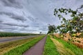 Pear trees along road and bikepath through agricultural landscape in Germany Royalty Free Stock Photo