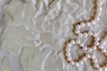 Pearl background with beautiful silk texture and string of natural rose pearl necklace Royalty Free Stock Photo