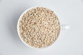 Pearl barley grains on a white background Royalty Free Stock Photo