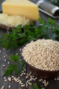 Pearl barley, herbs and cheese on the wooden table Royalty Free Stock Photo