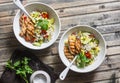 Pearl barley with seasonal garden vegetables and grilled chicken on wooden background, top view. Healthy balanced food Royalty Free Stock Photo