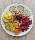 Pearl barley with soybeans, carrots, dried tomatoes. Baked potatoes, pumpkin and zucchini. Royalty Free Stock Photo