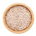 Pearl barley in wooden bowl isolated on white. Top view Royalty Free Stock Photo