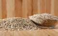 Pearl barley on a wooden surface, macro Royalty Free Stock Photo