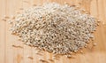 Pearl barley on a wooden surface, macro Royalty Free Stock Photo