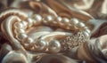 A pearl bracelet adorned with intricate charms resting on a luxurious satin material background