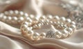 A pearl bracelet adorned with intricate charms resting on a luxurious satin material background