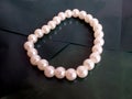 pearl bracelet on a green background Royalty Free Stock Photo