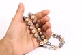 Pearl chain in the hand Royalty Free Stock Photo