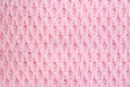 pearl-colored pattern with pink knitted fabric texture Royalty Free Stock Photo