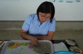 Pearl farm worker sorting produced high-quality pearl at Tung Sau Pearl Farm, Vietnam