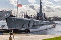 Pearl Harbor, Honolulu, Hawaii, USA - September 23, 2018: USS Bowfin submarine with a lot tourists on it docked next to the USS