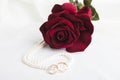 Pearl heart, a rose and wedding rings Royalty Free Stock Photo