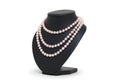 Pearl necklace on black mannequin on white background Royalty Free Stock Photo