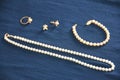 Pearl necklace, bracelet, ring and earrings Royalty Free Stock Photo