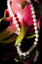 Pearl necklace and dragon fruit
