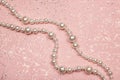 Pearl necklace on glitter pink background Royalty Free Stock Photo