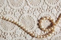 Pearl necklace on lace fabric Royalty Free Stock Photo