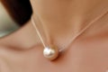 pearl necklace laying gracefully on a womans collarbone