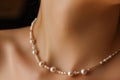 pearl necklace laying gracefully on a womans collarbone