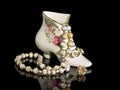 Pearl necklace in a porcelain shoe