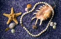 Pearl necklace with seashell and starfishes