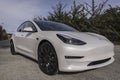 Pearl white electric Tesla Model 3 performance car near San Francisco California