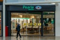 Pearle Opticien shop, illuminated sign above the store