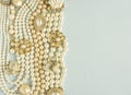 Pearls background. Woman`s Jewelry. Vintage jewelry background. Beautiful gold tone and pearls brooches, braceletes, necklaces an Royalty Free Stock Photo