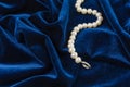 Pearls on blue velvet Royalty Free Stock Photo