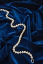 Pearls on blue velvet Royalty Free Stock Photo