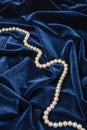 Pearls on blue velvet Royalty Free Stock Photo