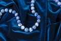 Pearls on blue velvet Royalty Free Stock Photo