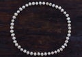 Pearls string circle shaped top view old wood