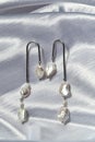 Pearly dangle earrings with natural stones