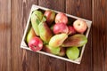 Pears and apples in wooden box on table Royalty Free Stock Photo