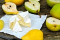 Pears and camembert cheese on a wooden surface. Royalty Free Stock Photo